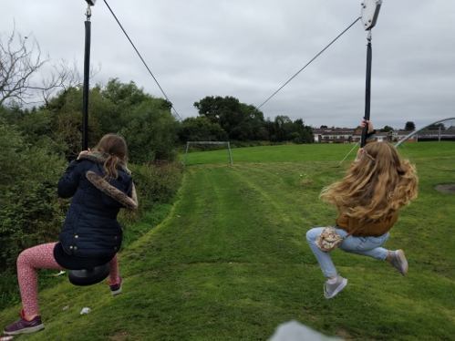 Slide Image2 children on the zip wire at Shellys Close playground
